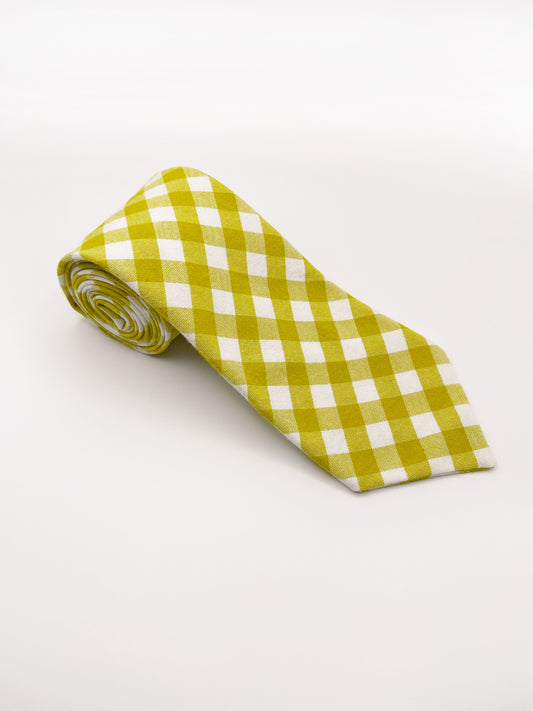 A cotton necktie with a green and white gingham plaid print.