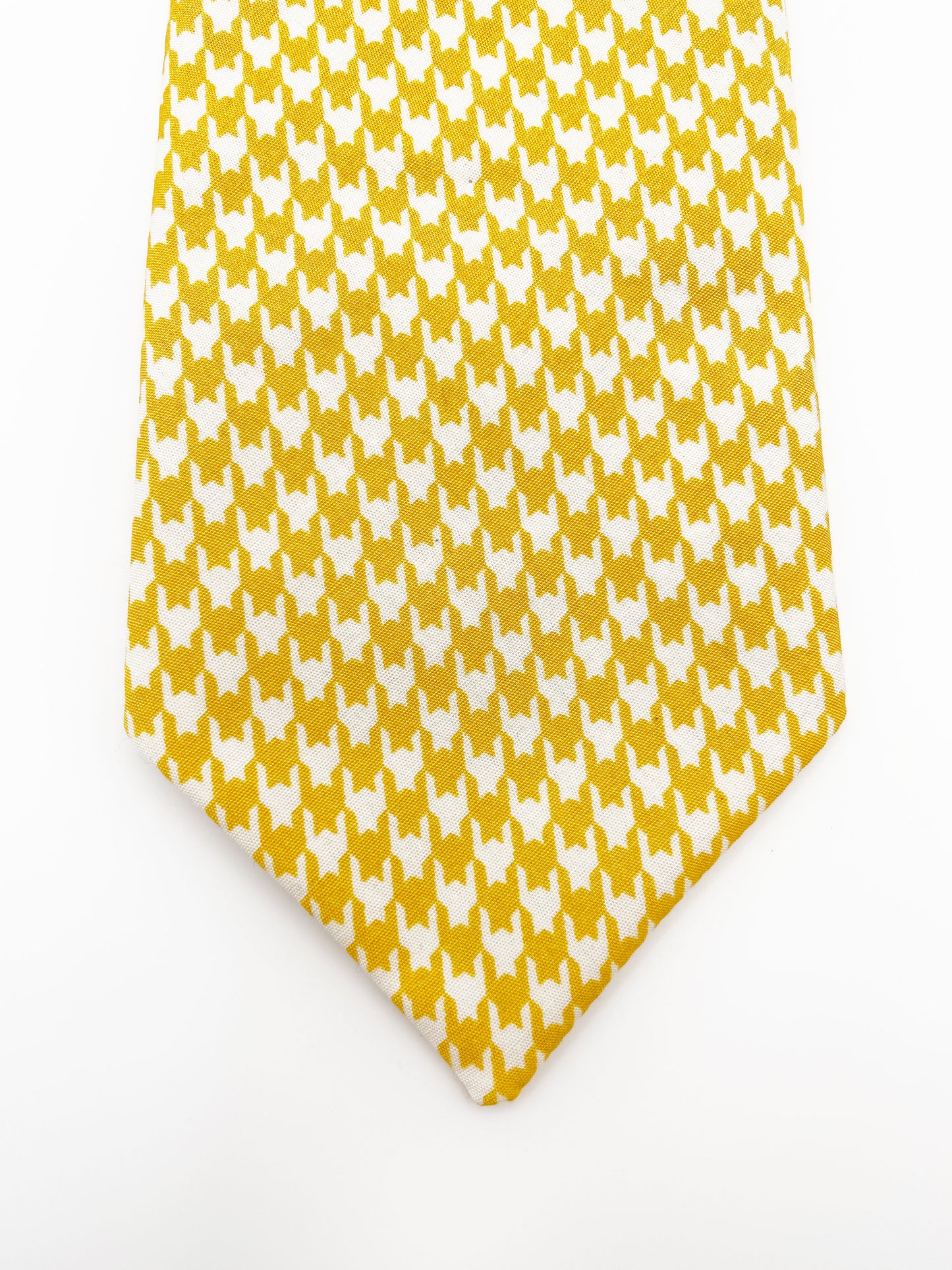 A handmade yellow houndstooth necktie.