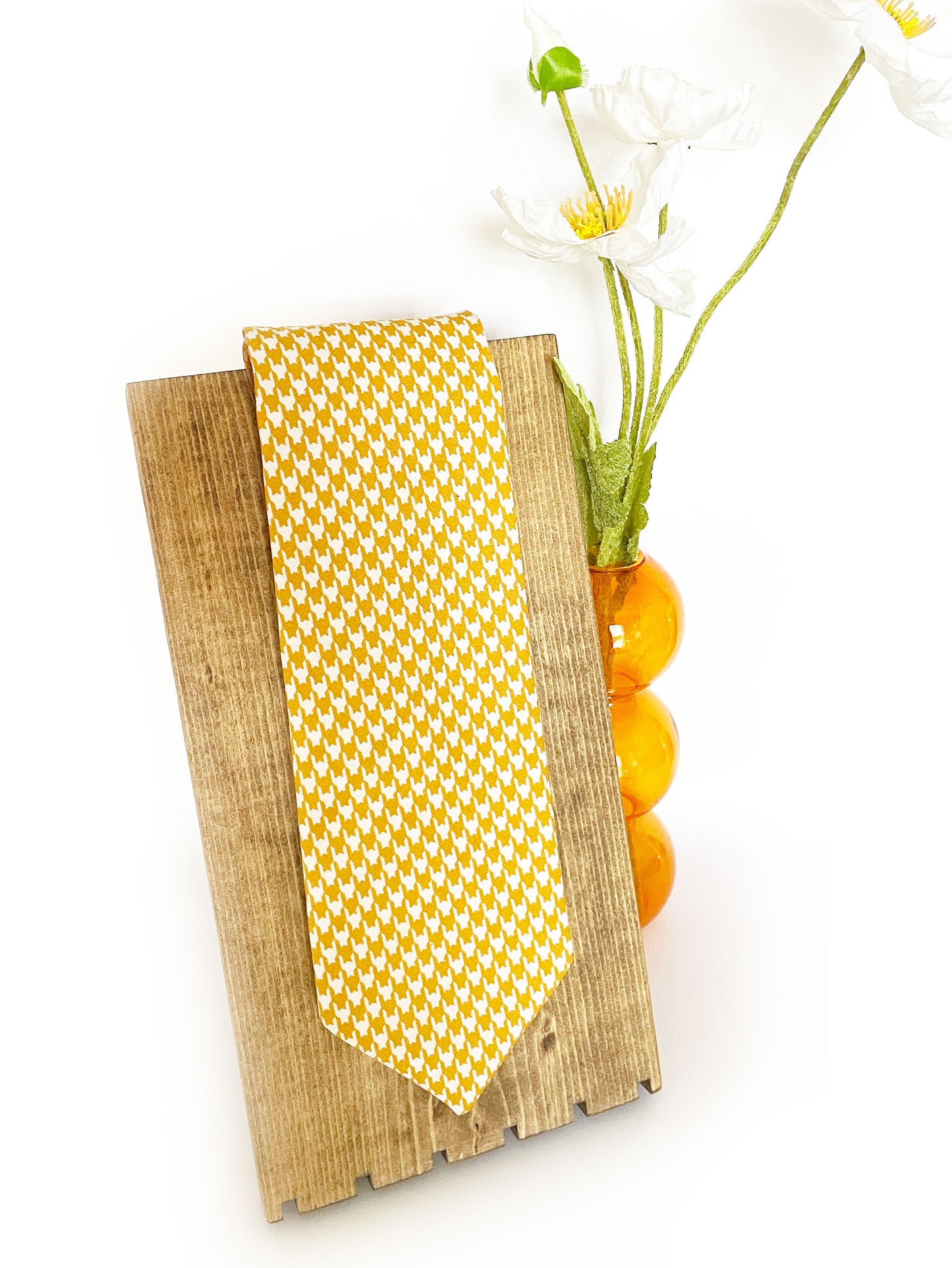 A handmade yellow houndstooth necktie.