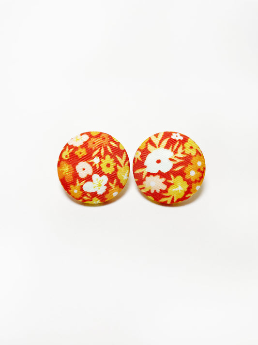 Handmade orange ditsy floral fabric covered post earrings.