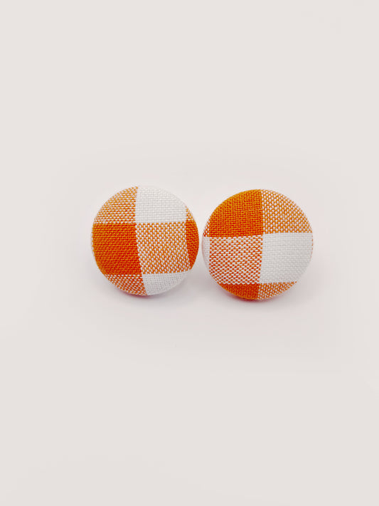 Handmade orange gingham plaid fabric covered post earrings.