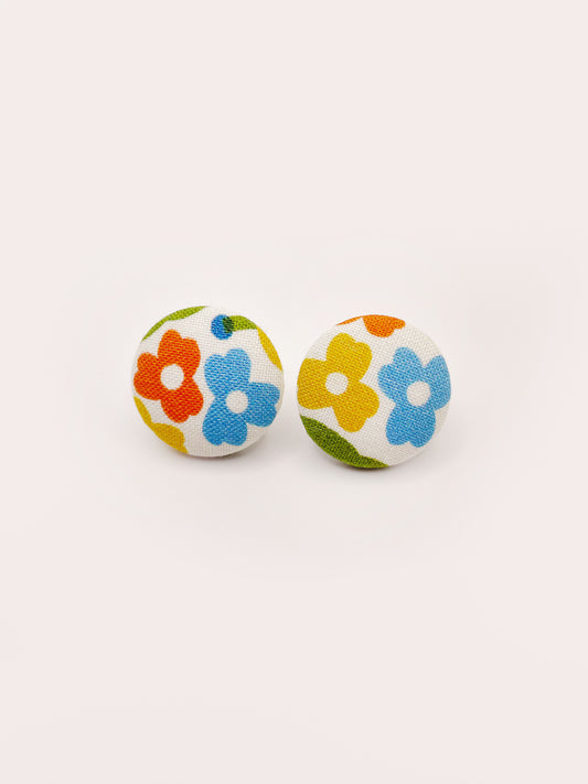 Handmade fabric-covered earrings with bold yellow, orange, and pink flowers.