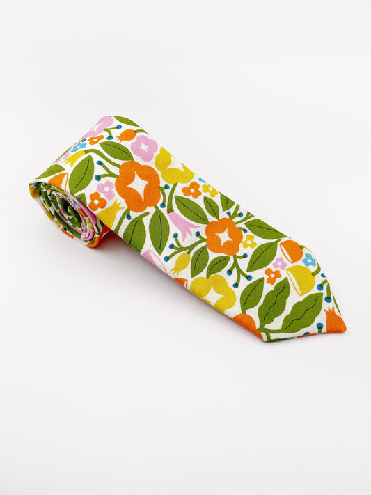 A vibrant necktie with bold yellow, orange, and pink flowers.