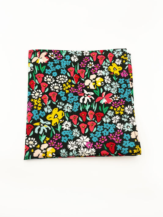 A handmade black colorful floral pocket square.