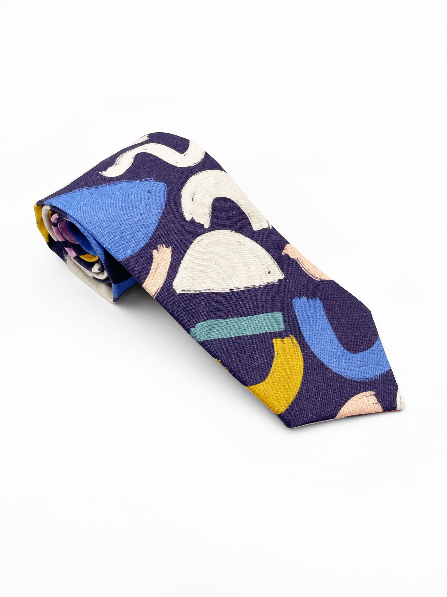 A cotton necktie with a colorful abstract print featuring various doodles.