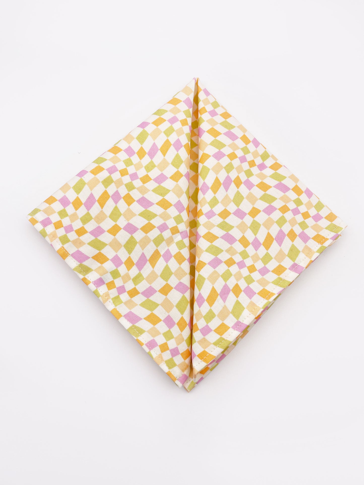 A handmade pocket square with a pastel checkered print.