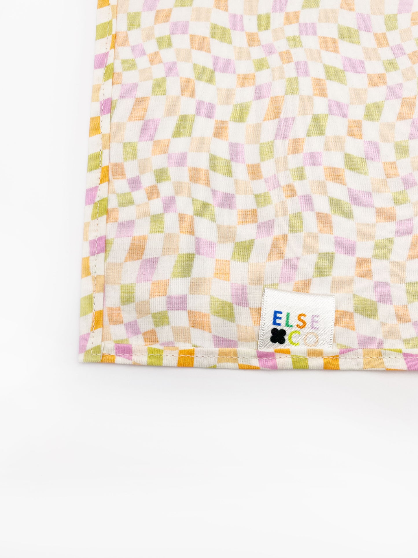 A handmade pocket square with a pastel checkered print.