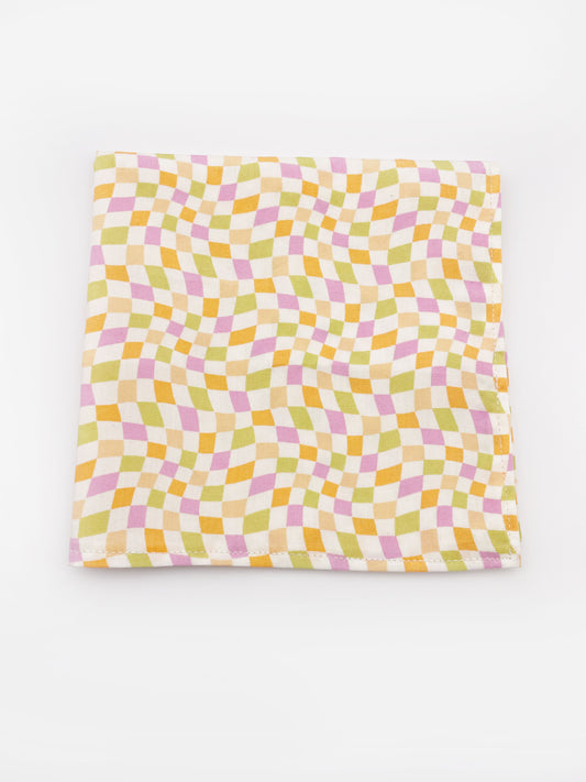 A handmade pocket square with a pastel checkered print.
