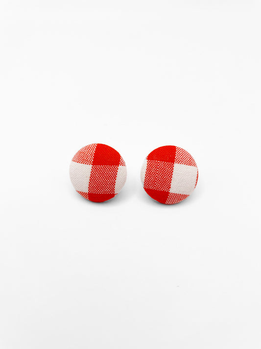 Fabric-covered earrings with a vibrant red gingham plaid print.