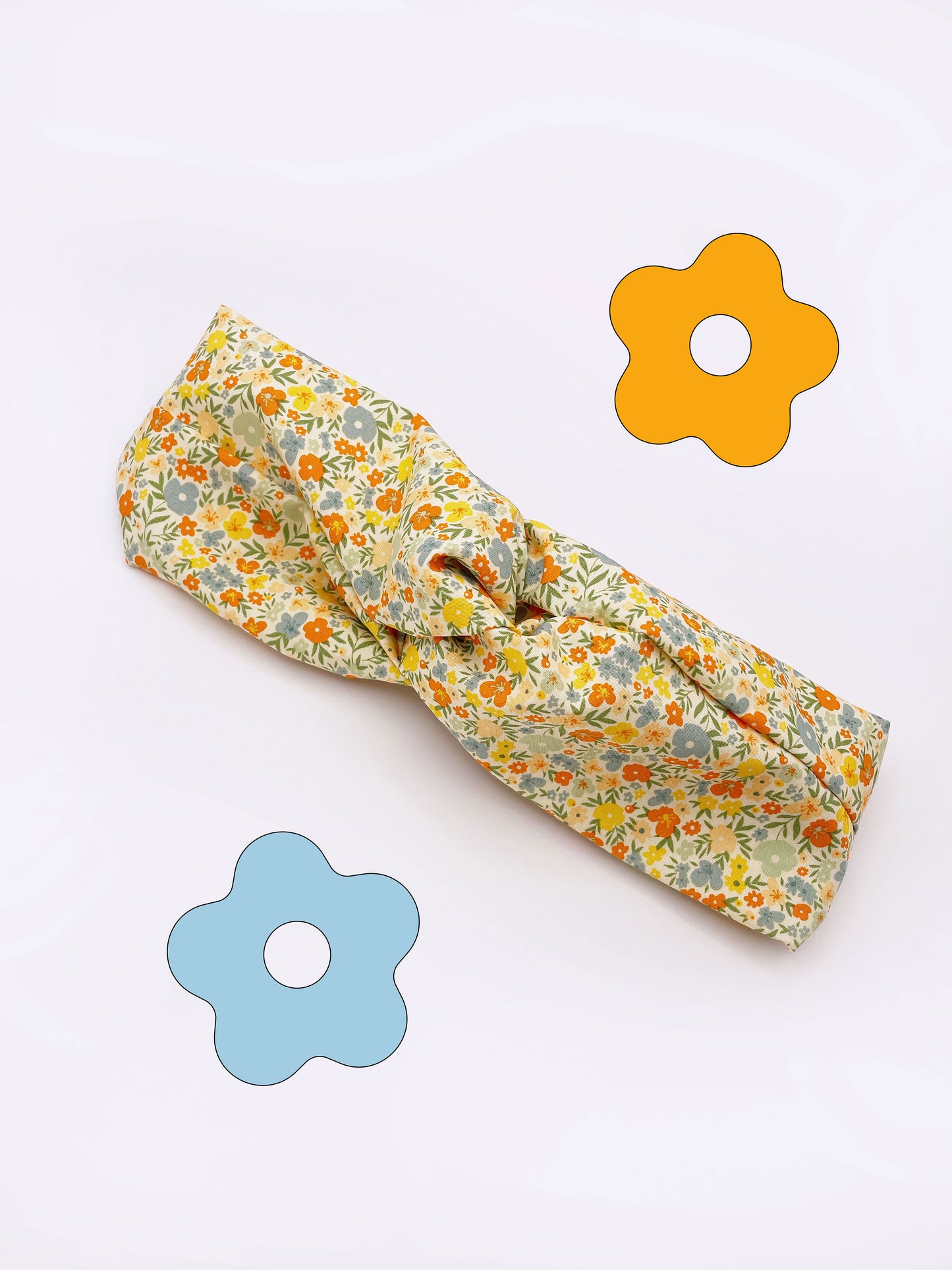 A cotton twist headband with a colorful ditsy floral print.