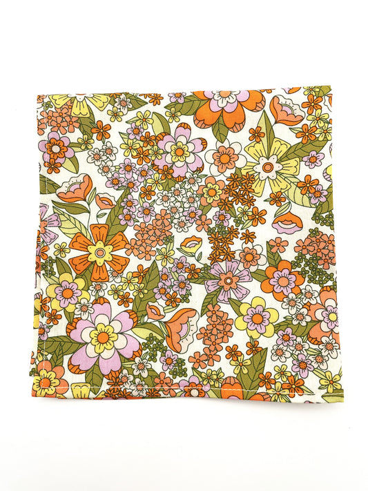A handmade retro floral pocket square.