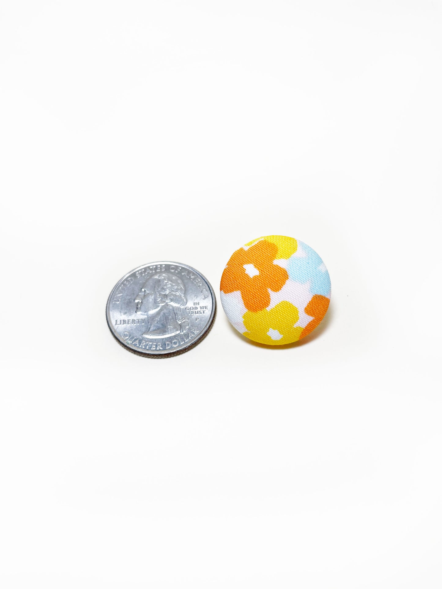 Handmade colorful floral fabric covered lapel pin. The earrings are 0.875 inches, roughly the same size as a quarter.