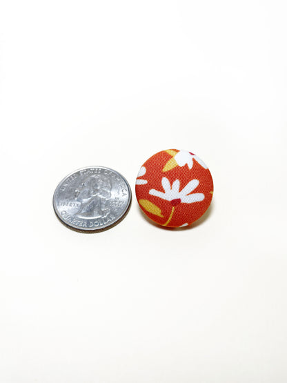 Handmade rust colored floral fabric covered lapel pin. The earrings are 0.875 inches, roughly the same size as a quarter.