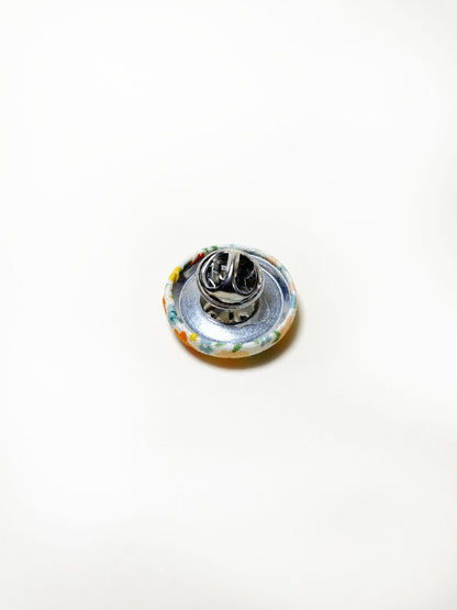 Handmade ditsy floral fabric covered lapel pin. Each pin has a clutch back closure.