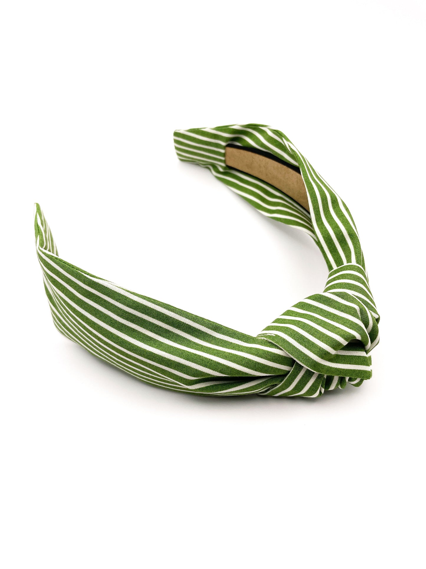 A handmade knotted headband featuring a white striped print against a moss green background.