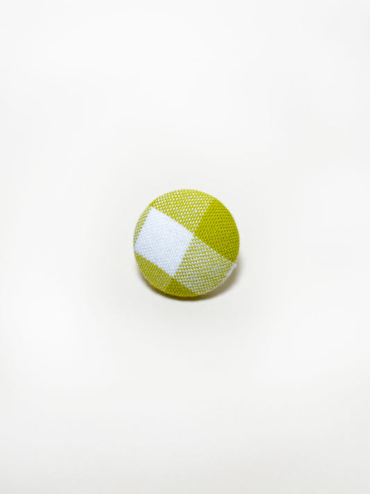 Handmade green gingham plaid fabric covered lapel pin.