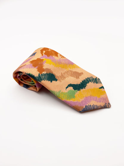 A necktie crafted from high-quality cotton with an abstract design inspired by the rolling hills and earthy tones of the desert. 