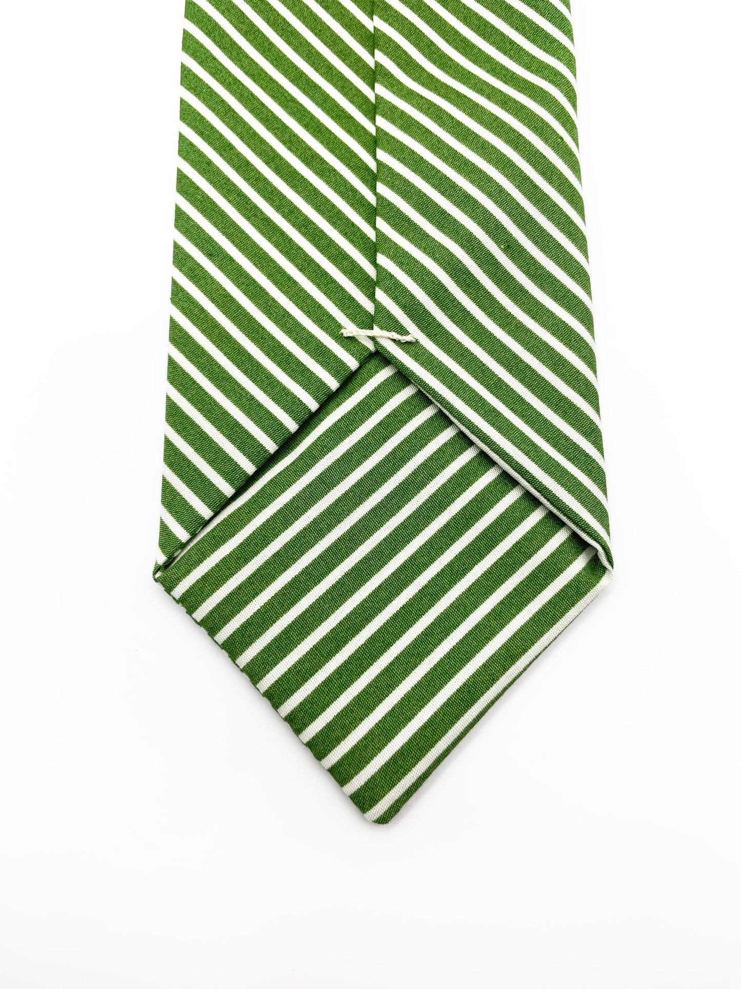 A handmade green necktie with white stripes.