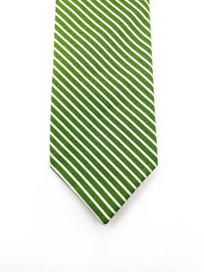 A handmade green necktie with white stripes.