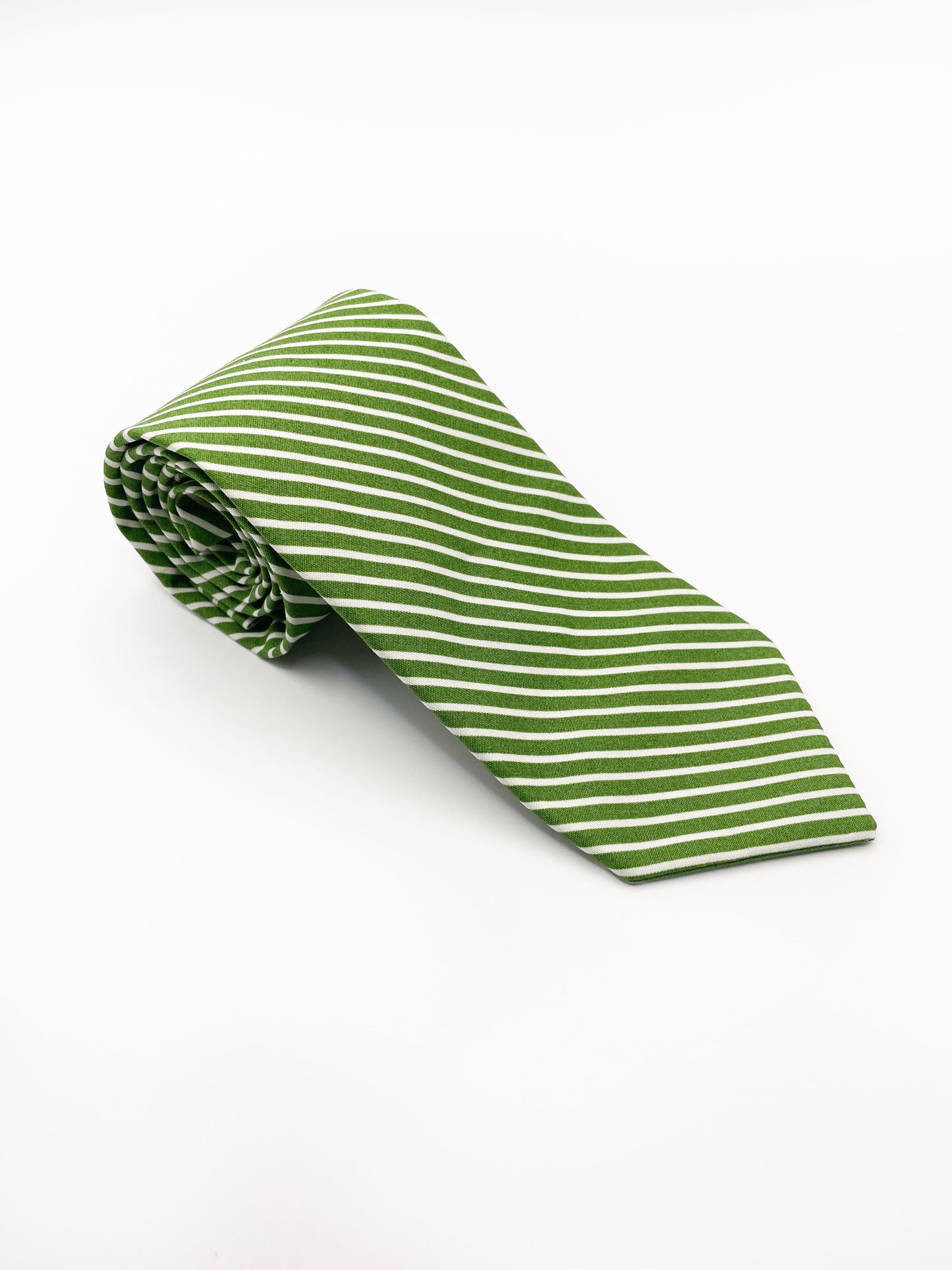 A handmade green necktie with white stripes.