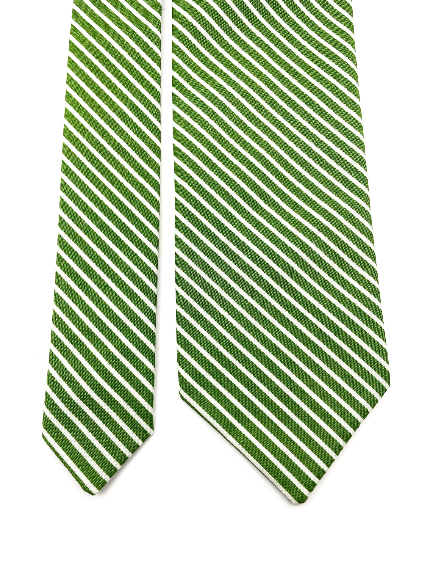 A handmade green necktie with white stripes.