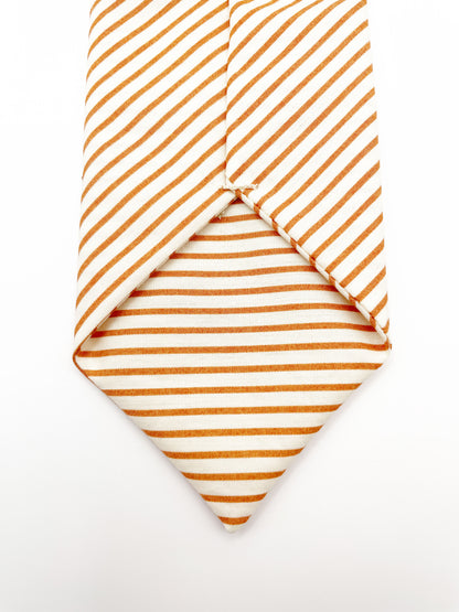 A handmade copper striped boho necktie.