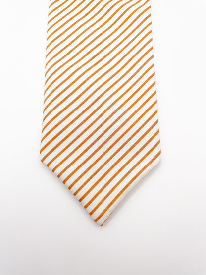 A handmade copper striped boho necktie.