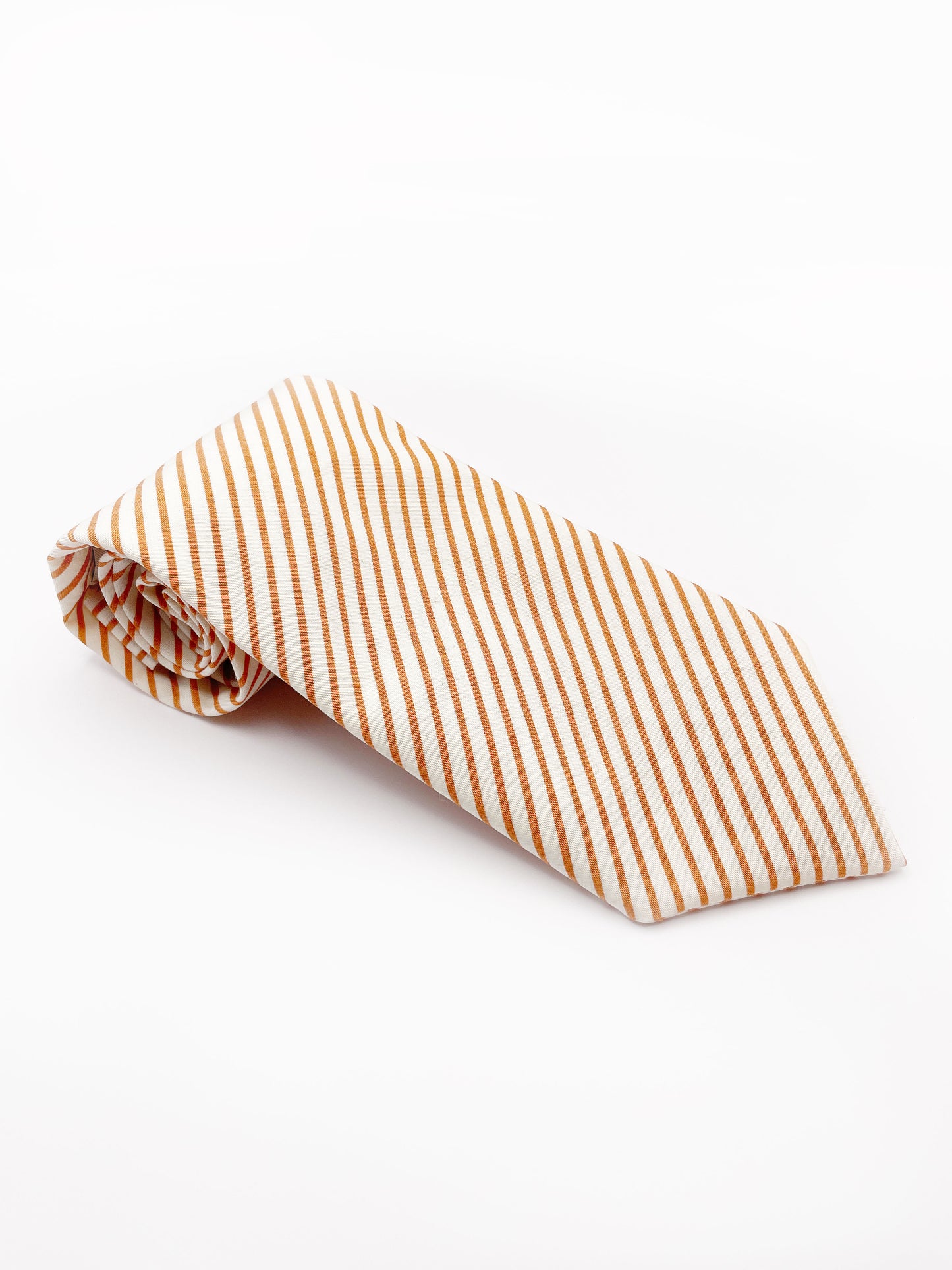 A handmade copper striped boho necktie.