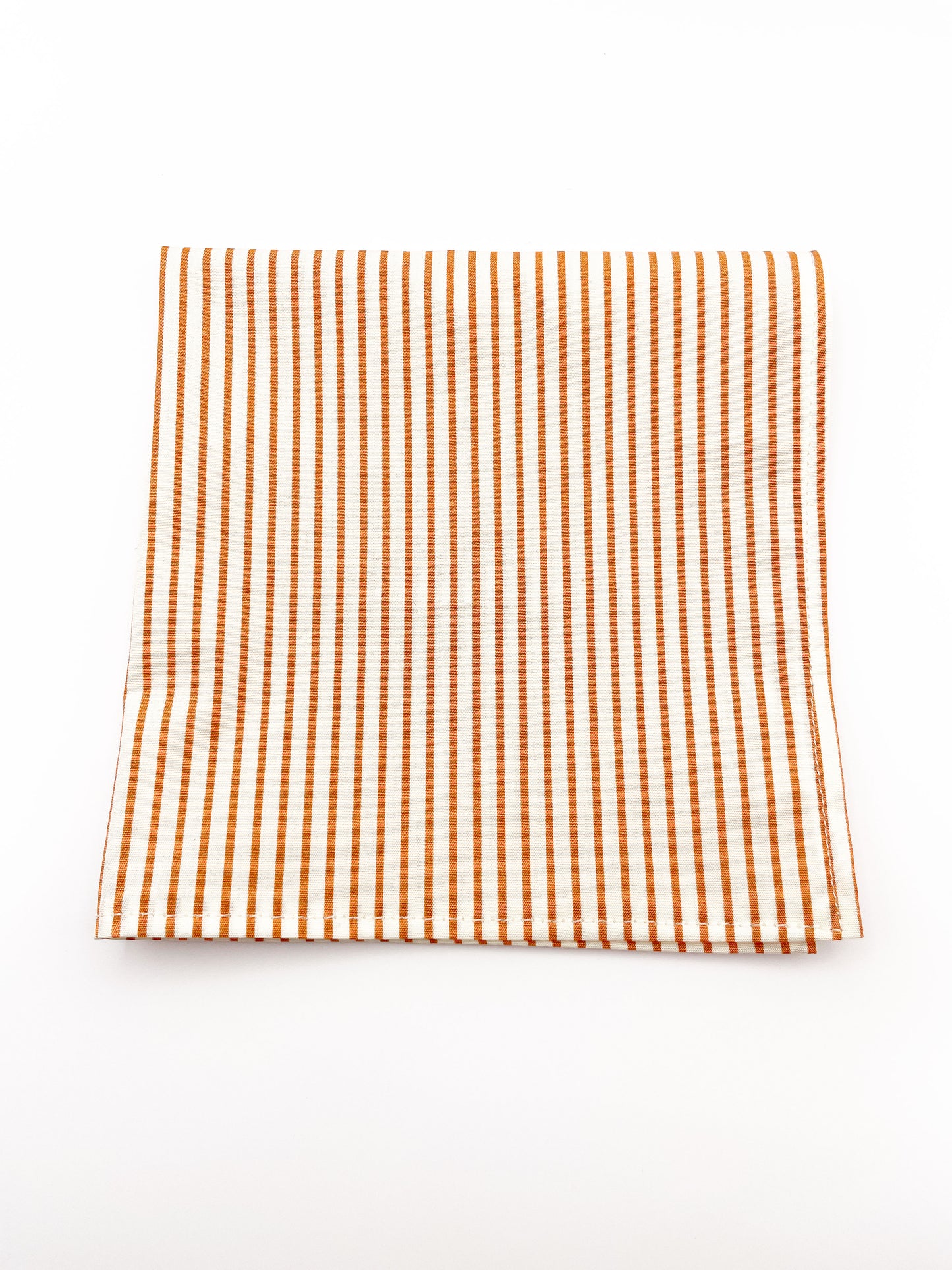 A handmade pocket square with copper stripes.