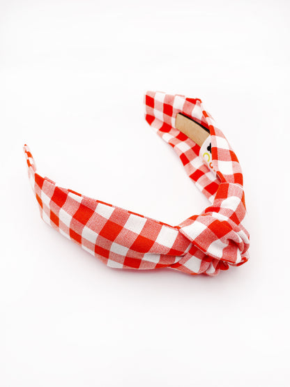 Cotton knotted headbands with a vibrant red gingham plaid print. 