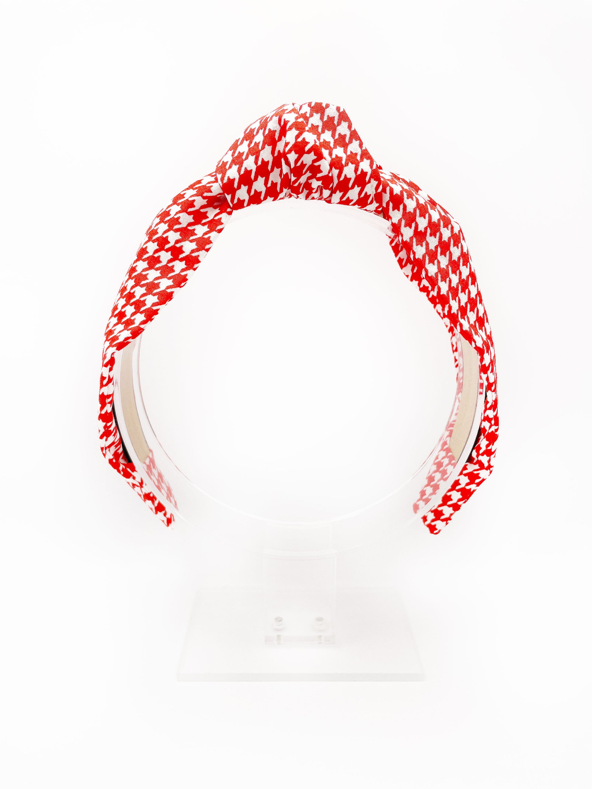 A handmade red houndstooth knotted headband. 