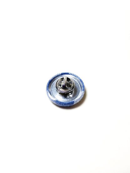 Handmade slate blue gingham plaid fabric covered lapel pin. Each pin has a clutch back closure.