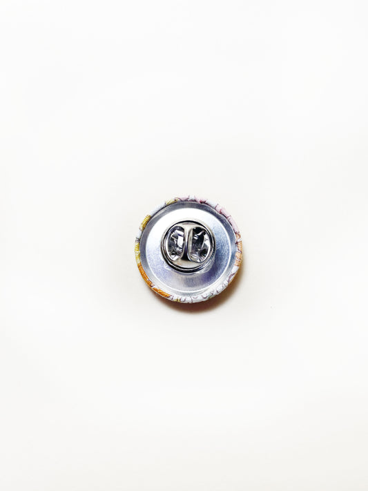 Handmade yellow floral fabric covered lapel pin. Each pin has a clutch back closure.