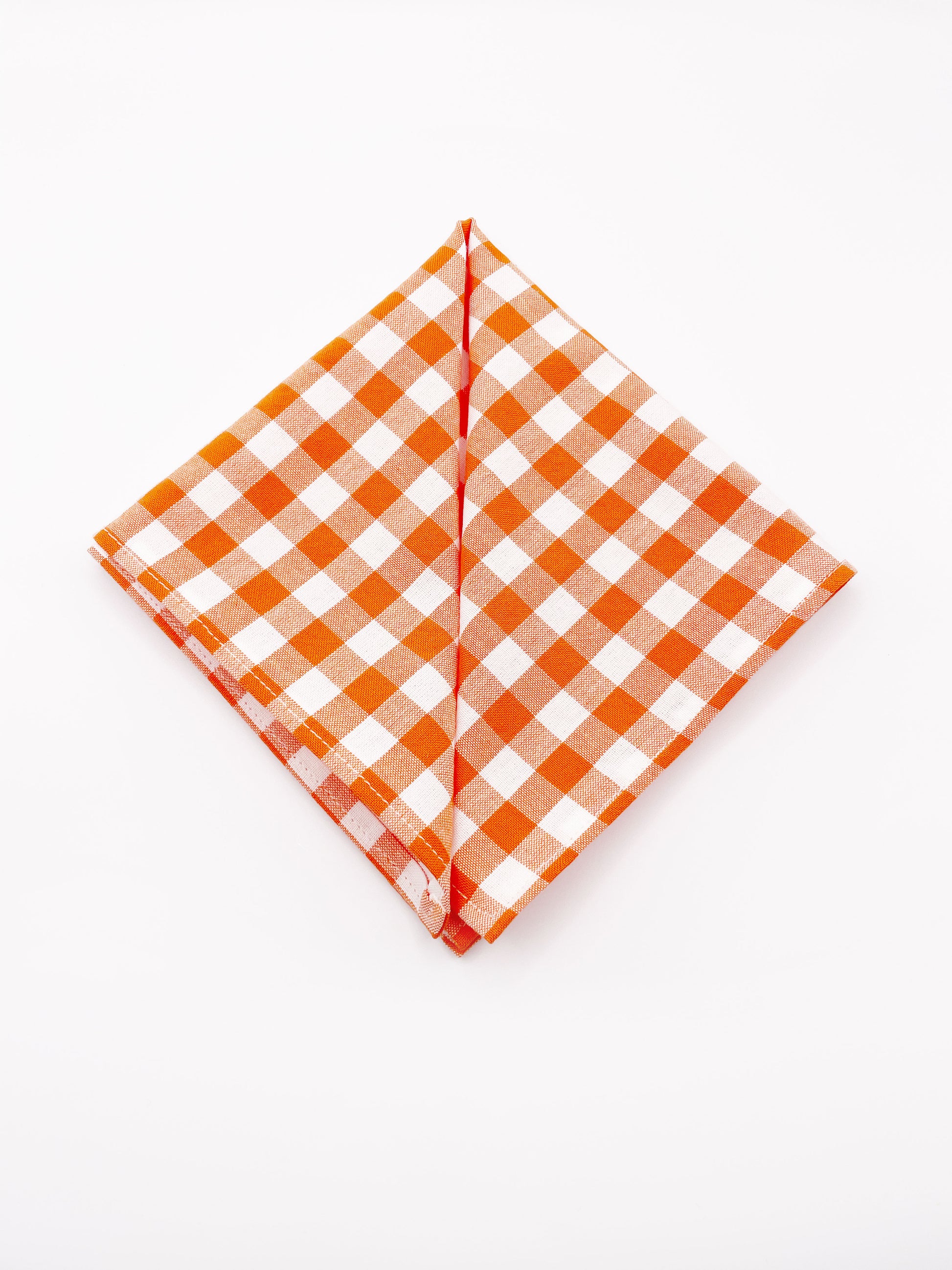 An orange and white gingham plaid pocket square.