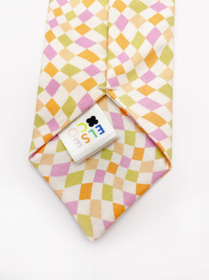 A handmade necktie with a pastel checkered print. Each necktie is carefully hand-stitched.