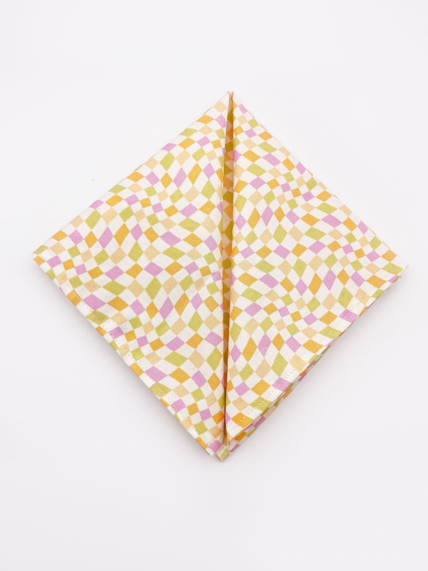 A handmade pocket square with a pastel checkered print. 