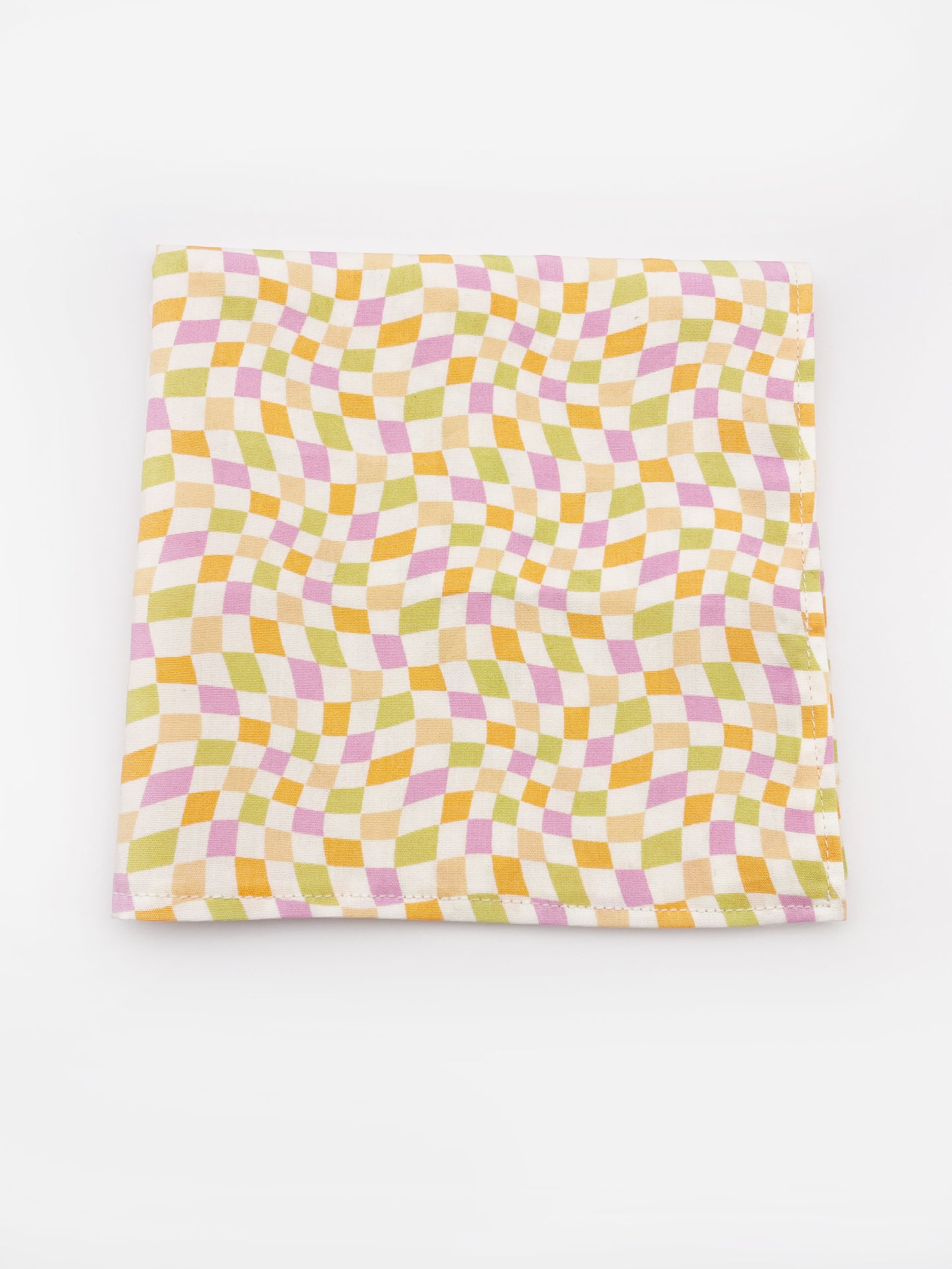 A handmade pocket square with a pastel checkered print. 