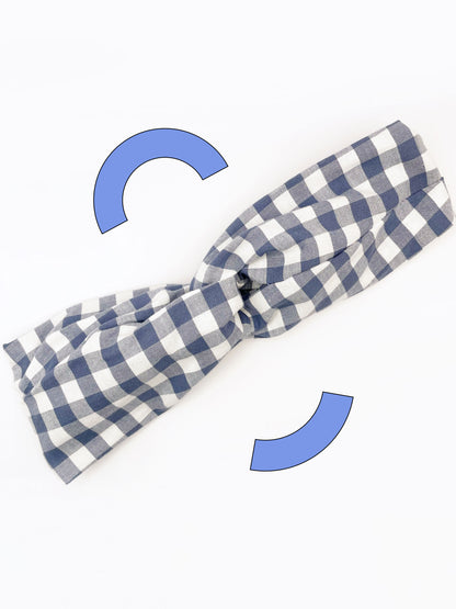 A cotton twist headband with a classic slate blue gingham plaid print. 