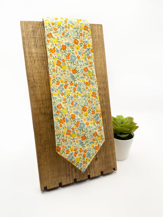 A handmade floral necktie with a small ditsy flower print. 