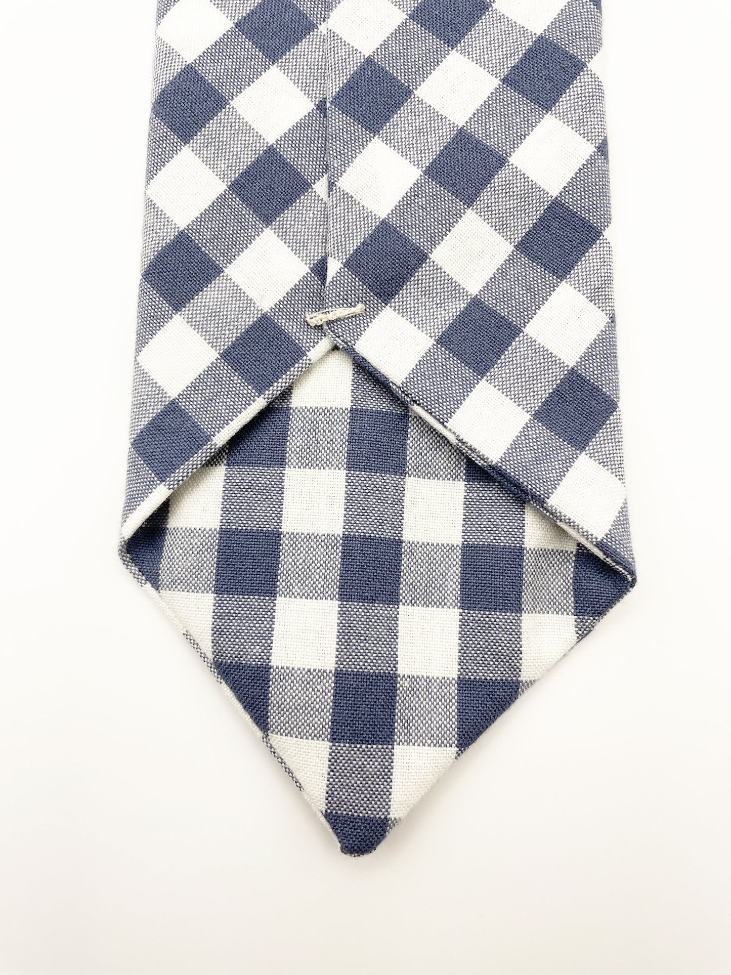 A handmade slate blue gingham plaid necktie.