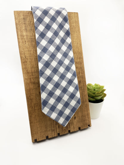 A handmade slate blue gingham plaid necktie.