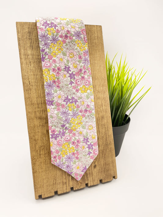 A handmade purple floral necktie.