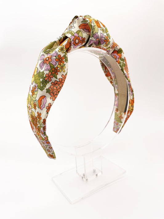 A handmade retro floral knotted headband.