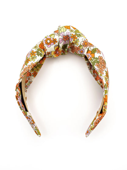 A handmade retro floral knotted headband.