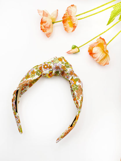 A handmade retro floral knotted headband.