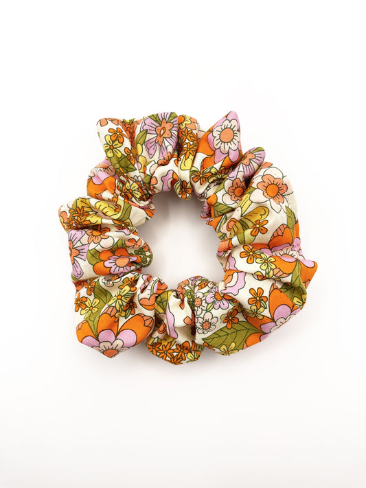 A handmade retro floral scrunchie.