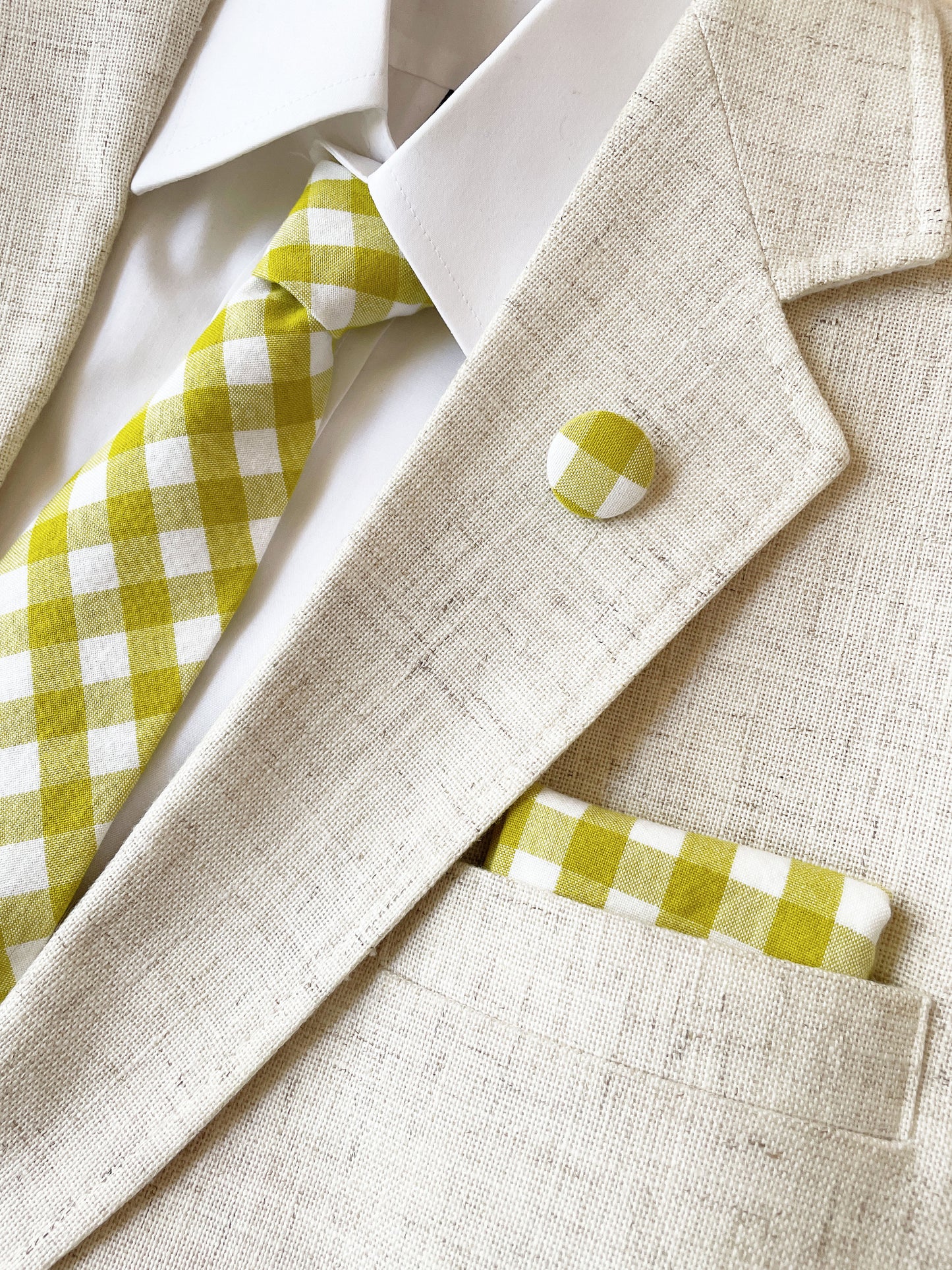 A green and white gingham plaid pocket square.